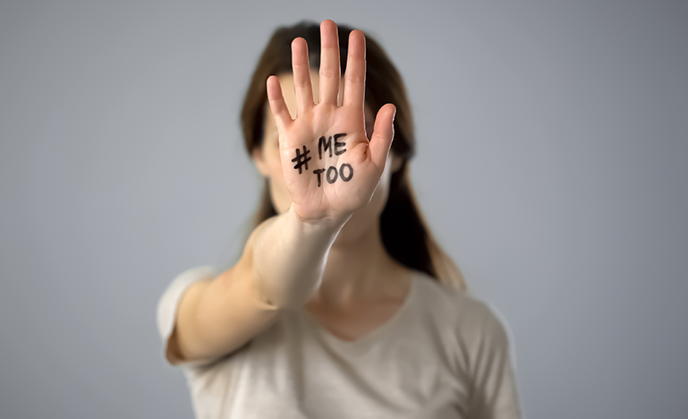 girl holding hand in front of her face